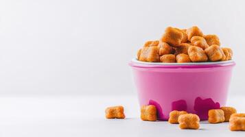 A pink cup filled with orange cheetos photo