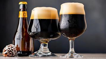 Two glasses of beer and a bottle of beer photo