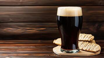 A glass of dark beer and some bread photo