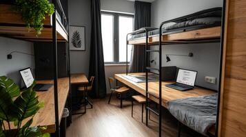 A bunk bed with two desks and a laptop photo