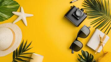Summer vacation concept with hat, sunglasses, camera, palm leaves, starfish, notebook, photo