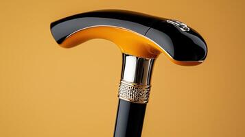 A black and yellow walking cane with a silver handle photo