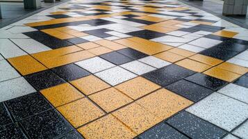 A yellow and black tile floor photo