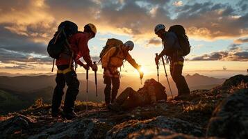 Four people with backpacks on a mountain at sunset photo