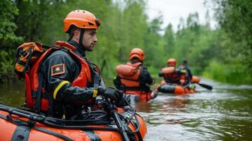 A group of people in orange life jackets on a river photo