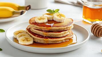 A stack of pancakes on a plate photo