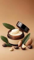 Almond butter and almond nuts on a brown background photo
