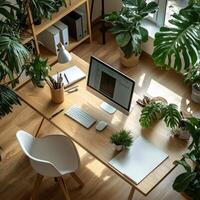 An office with a desk, computer, and plants photo