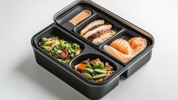 A black lunch box with four compartments photo