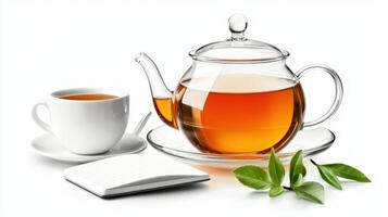 Tea and cup of tea with notebook and green leaves isolated on white background photo