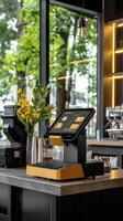 A coffee shop with a cash register and a table photo