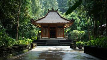 A small building in the middle of a lush green forest photo