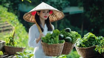 A woman in a traditional vietnamese hat is holding baskets of vegetables photo