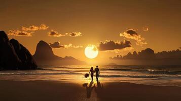 A man and woman walking on the beach at sunset photo