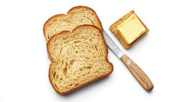 A slice of bread and butter on a white surface photo