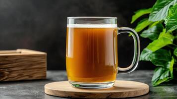 A glass of beer on a wooden coaster photo