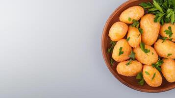 A wooden bowl filled with potatoes and parsley photo
