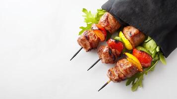 Grilled meat skewers with vegetables on a white background photo