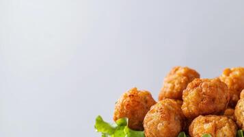 A bowl of fried chicken nuggets with lettuce photo