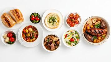 A variety of different dishes on white plates photo