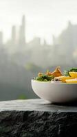 A bowl of food sitting on a table photo