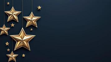 Golden stars hanging on strings on a black background photo