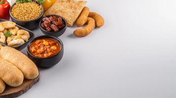 A variety of food items including bread, beans, and other items photo