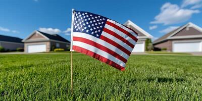 American flag on lawn in front of houses photo