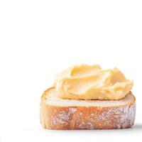 Butter on bread with a white background photo