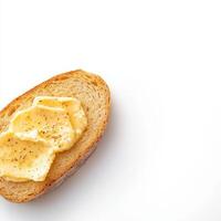 A piece of bread with butter on it photo