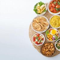 A bowl of food is arranged on a table photo