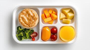 A white plastic tray with a variety of food photo