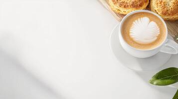 Coffee and biscuits on a white table top view photo