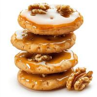 A stack of cookies with caramel and walnuts photo