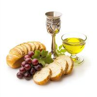 A glass of wine, bread, grapes and bread photo