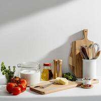 Kitchen utensils on a white counter top photo