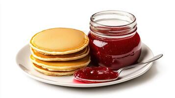 Pancakes and jam on a plate photo