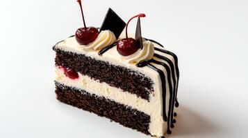 A piece of cake with chocolate frosting and cherries photo