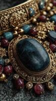 Intricate jewelry collection featuring emerald, ruby, and gold craftsmanship displayed on a textured surface photo