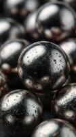 Close-up view of shiny metallic spheres showcasing unique textures and finishes in an abstract arrangement photo