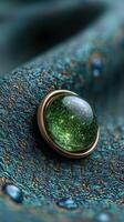 Elegant green gemstone on intricate fabric texture showcasing luminous details photo