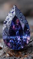Stunning close-up of a violet gemstone with water droplets reflecting light on a textured surface photo