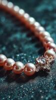 Elegant pearl necklace with intricate clasp resting on a sparkling surface in soft lighting photo