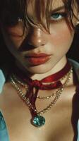 Close-up portrait of a model with striking features and bold accessories in dramatic lighting photo