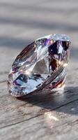 Sparkling clear diamond set on a wooden surface illuminated by soft natural light creating a stunning visual effect photo