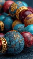 Colorful decorative beads in intricate designs displayed on a textured surface at a craft fair photo