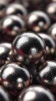 Metallic spheres clustered together showcasing reflective surfaces in intricate detail at close range photo