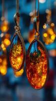 Beautiful amber jewelry pendants displayed in a vibrant market during the evening photo