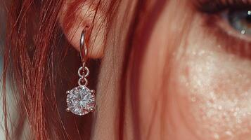 Elegant jewelry piece showcased on a close-up of a model's ear with red hair and subtle makeup in a well-lit setting photo