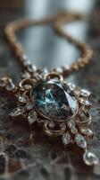 Intricate vintage necklace featuring a large blue gemstone and sparkling crystals on a marble surface photo